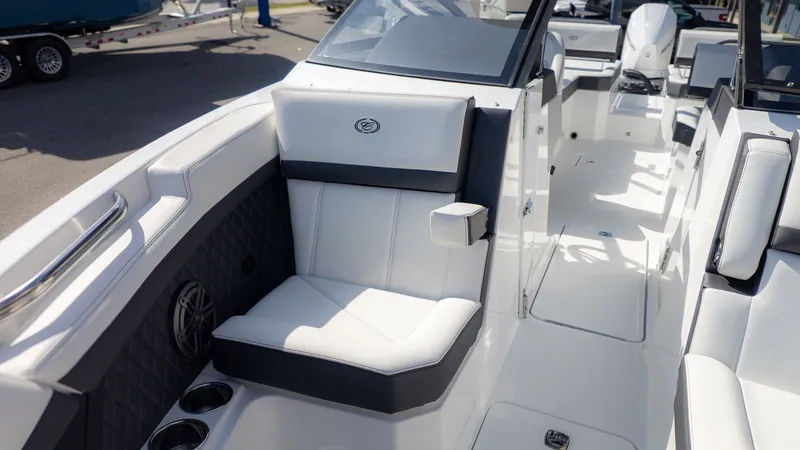 Slide: The Image of The image shows the cockpit of a Cobalt R6 boat with white and black seating. - 24
