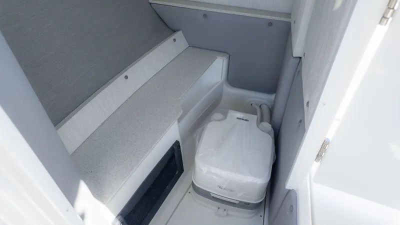 Slide: The Image of Interior of a Cobalt R6 featuring a toilet and seating area. - 17