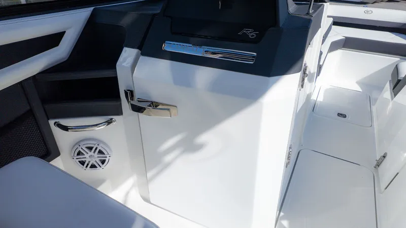 Slide: The Image of The image shows the cockpit of a Cobalt R6 boat with modern details and speakers. - 16