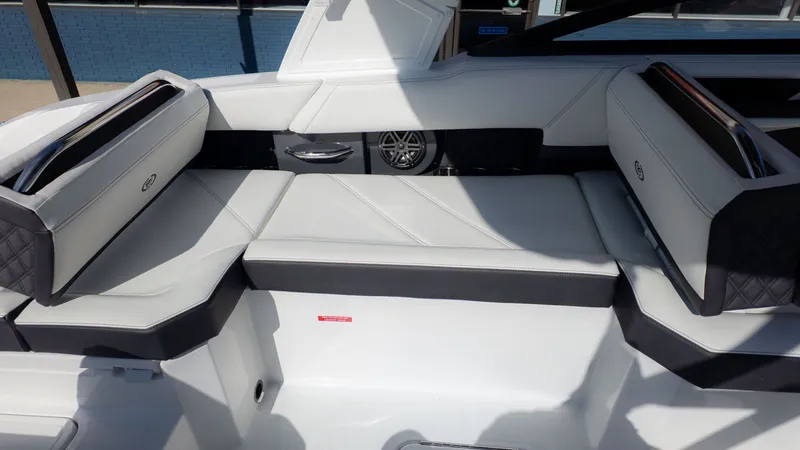 Slide: The Image of The image shows the luxurious white seating area of a Cobalt R6 boat. - 10