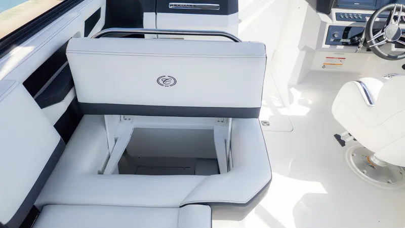 Slide: The Image of The image shows the interior of a Cobalt R6 boat with white upholstery and a helm station. - 7