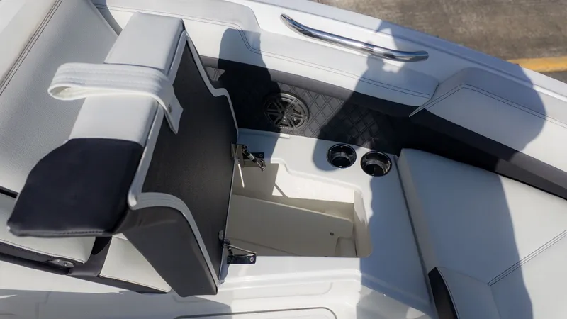 Slide: The Image of The image shows the interior of a Cobalt R6 boat with white upholstery and cup holders. - 20