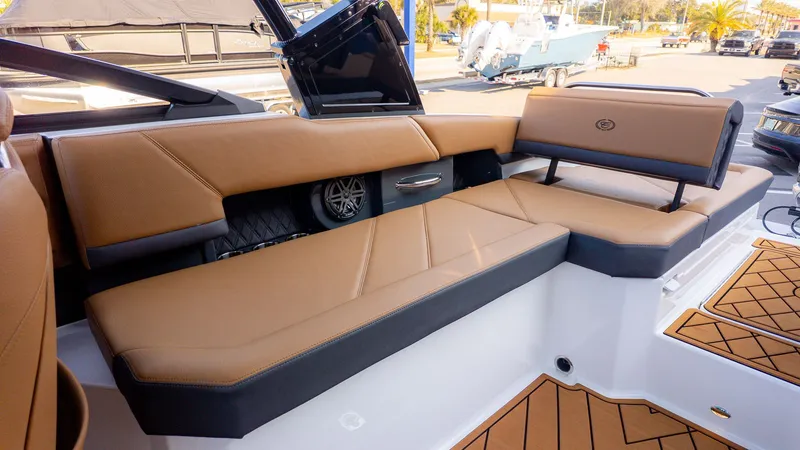 Slide: The Image of The image shows the cockpit of a Cobalt R6B boat with brown upholstery and modern details. - 6
