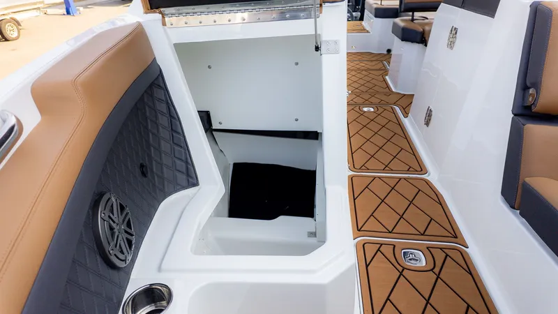 Slide: The Image of Interior of a Cobalt R6B boat with brown and white accents. - 23