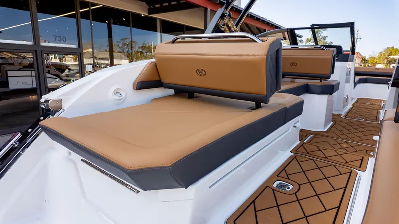 Slide: The Image of The image shows the deck of a Cobalt R6B boat with brown upholstery and modern details. - 7