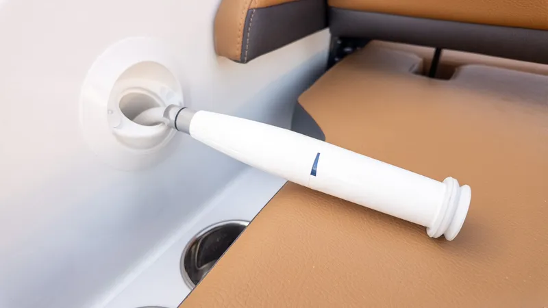 Slide: The Image of Close-up of a white hose in a boat with brown upholstery. - 9