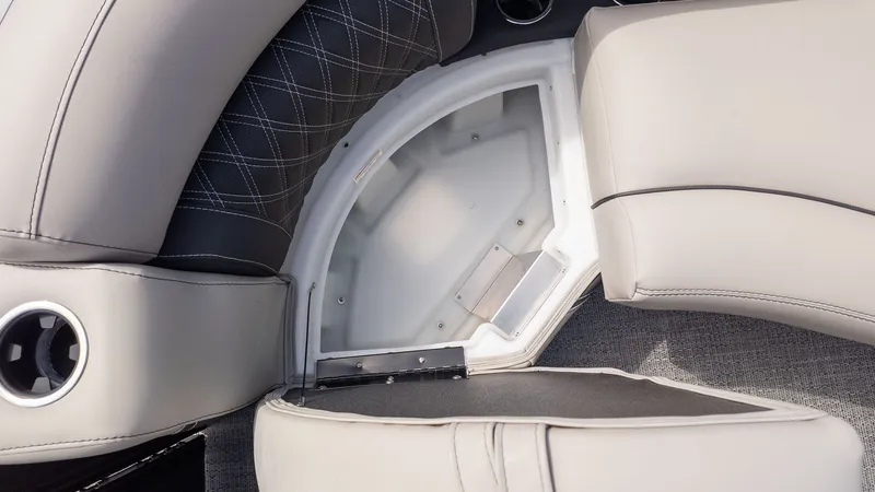 Slide: The Image of Close-up of a seating area with storage in a Barletta Lusso 25UE boat. - 22