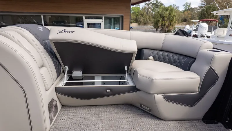 Slide: The Image of Interior of a Barletta Lusso 25UE with elegant upholstered seating and storage space. - 18