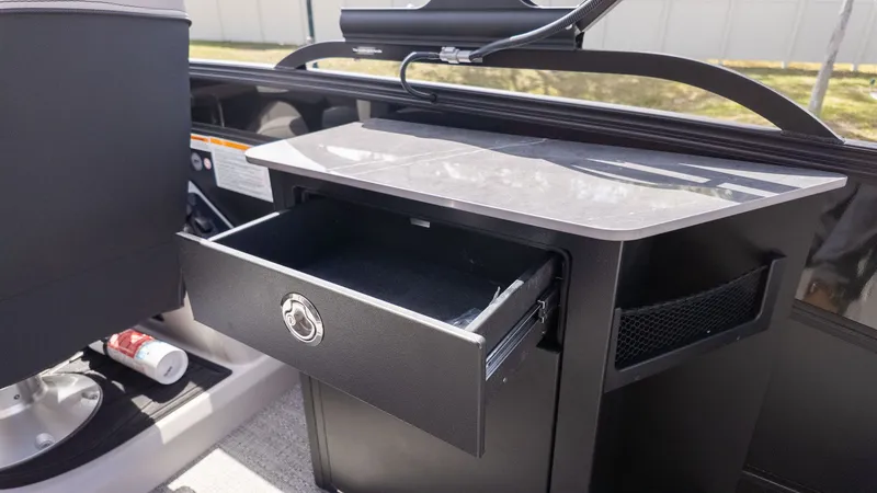Slide: The Image of Interior view of a Barletta Lusso 25UE with an open cabinet and drawer. - 30