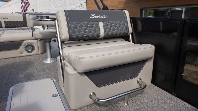 Slide: The Image of The image shows a luxurious seat on a Barletta Lusso 25UE boat. - 12