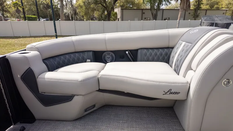 Slide: The Image of The image shows the luxurious interior design of a 2026 Barletta Lusso 25UE with elegant seating. - 23
