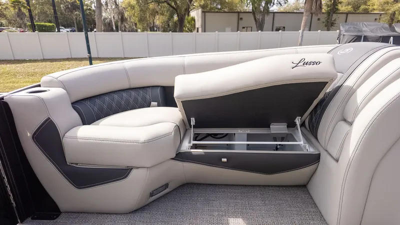 Slide: The Image of The image shows the luxurious interior of a Barletta Lusso 25UE boat with elegant seating. - 22