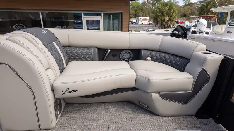 Slide: The Image of The image shows the luxurious interior of a Barletta Lusso 25UE with elegant seating. - 18