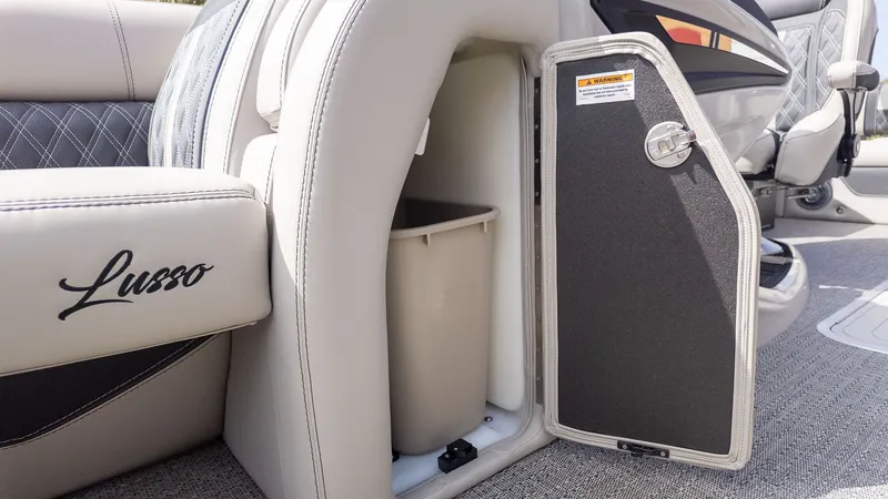 Slide: The Image of Interior of Barletta Lusso 25UE featuring storage compartment and trash bin. - 24