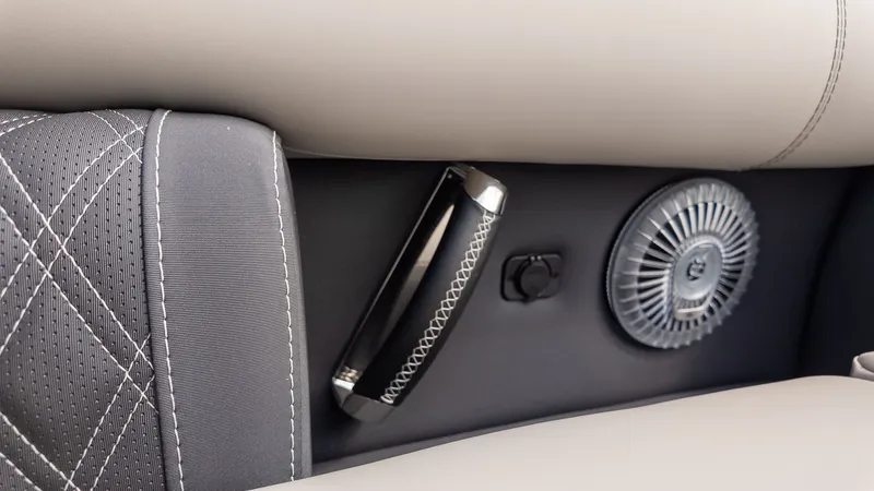 Slide: The Image of Close-up of a sleek boat seat with speaker and handle. - 15