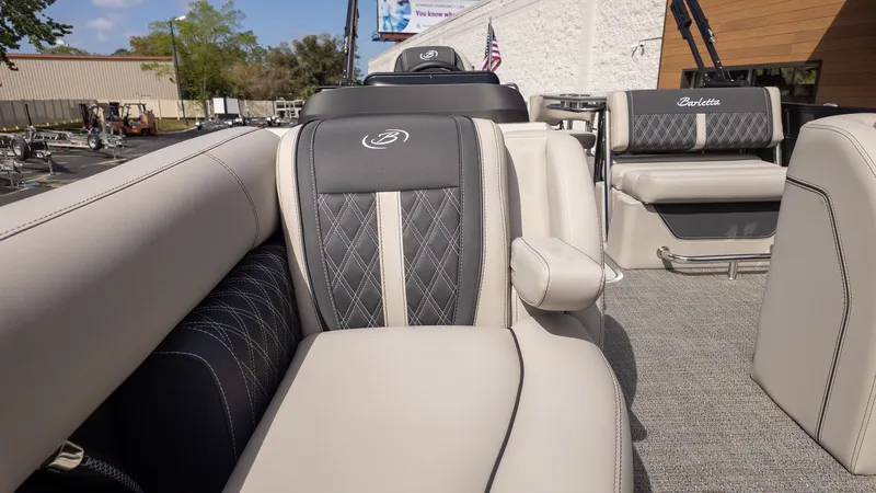 Slide: The Image of Interior of a Barletta Lusso 25UE with sleek, upholstered seating and modern design. - 23
