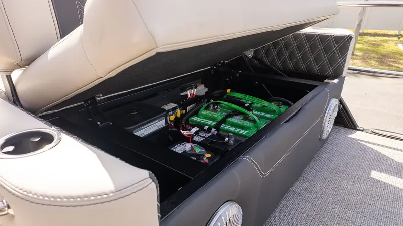 Slide: The Image of Battery compartment of the 2026 Barletta Lusso 25UE with green batteries. - 7