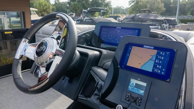 Slide: The Image of The image shows the helm of a Barletta Lusso 25UE with modern navigation systems. - 35