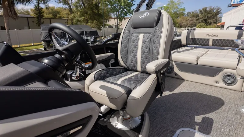 Slide: The Image of The interior of a 2026 Barletta Lusso 25UE with luxurious seating and sleek details. - 25