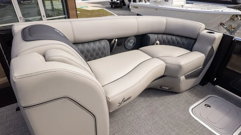 Slide: The Image of Luxurious cream leather seating on a modern boat with elegant stitching and speakers. - 14