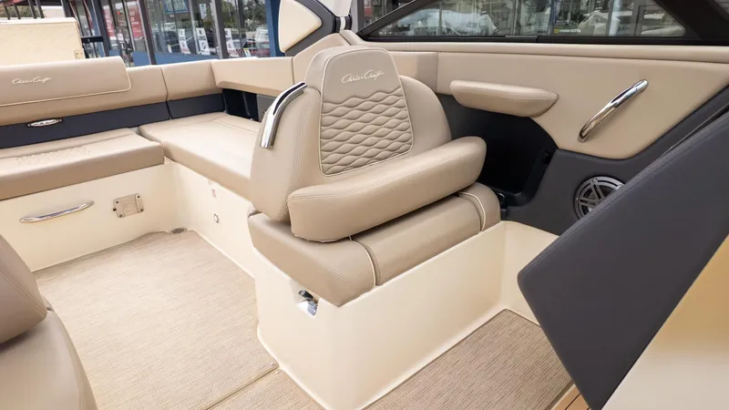 Slide: The Image of Interior of a Chris-Craft Sportster 28 with beige leather seating and sleek details. - 20