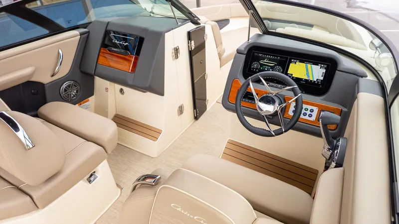 Slide: The Image of Interior view of a Chris-Craft Sportster 28 with luxurious seating and modern helm console. - 19