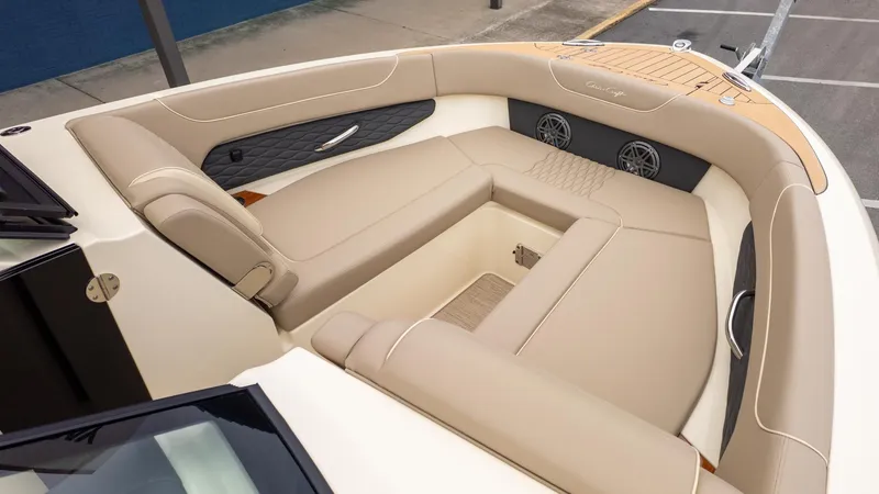 Slide: The Image of The image shows the cockpit of a Chris-Craft Sportster 28 with beige upholstery and sleek details. - 11