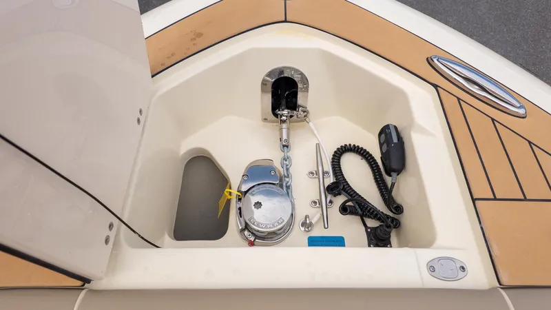 Slide: The Image of Anchor locker with windlass and controls on a boat. - 17