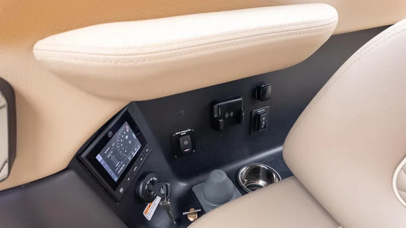 Slide: The Image of Close-up of a Chris-Craft Sportster 28 control area with controls and a display. - 26