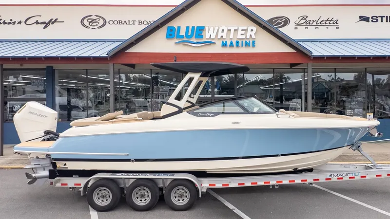 Slide: The Image of 2026 Chris-Craft Sportster 28 on a trailer in front of a boat dealership. - 29