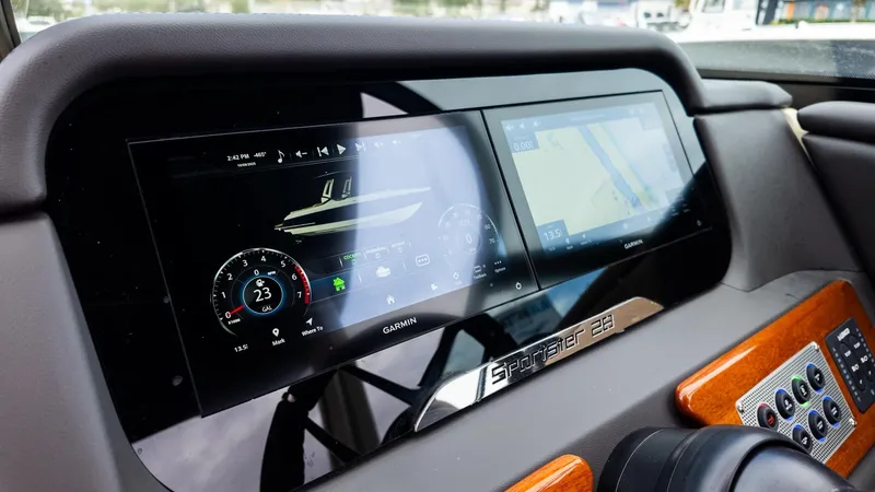 Slide: The Image of Dashboard of a Chris-Craft Sportster 28 with modern digital displays. - 23