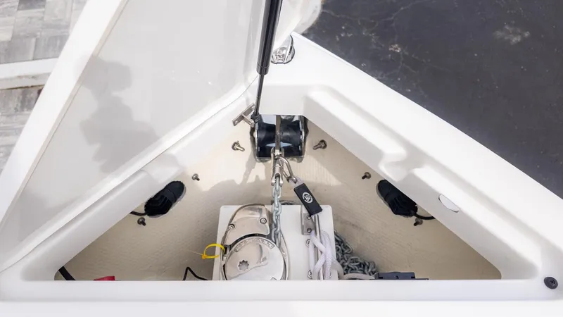 Slide: The Image of Anchor locker of a Cobalt R6 Surf boat with anchor and rope. - 24