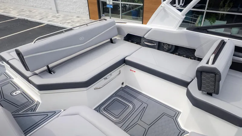 Slide: The Image of The image shows the spacious cockpit of a Cobalt R6 Surf boat with gray upholstery. - 8