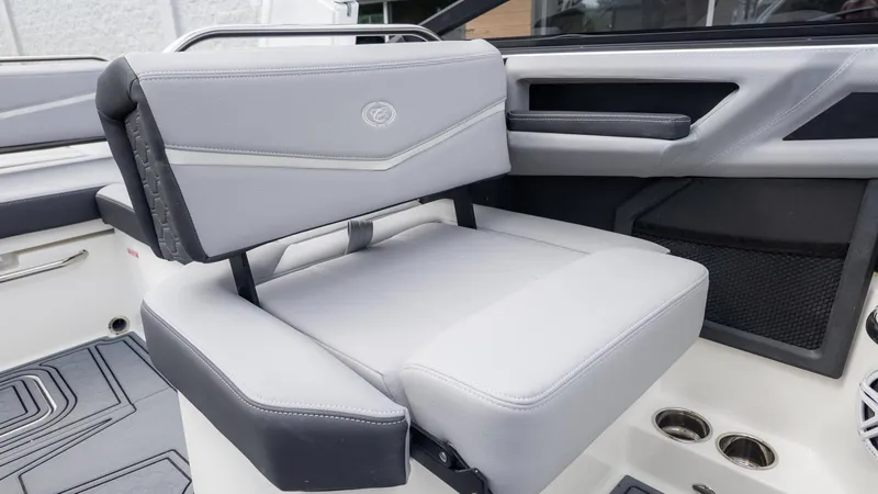 Slide: The Image of Interior of a Cobalt R6 Surf boat with gray upholstery and modern armrests. - 17
