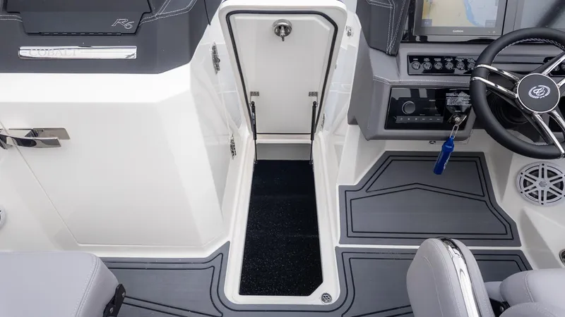 Slide: The Image of The image shows the cockpit of a 2026 Cobalt R6 Surf boat with modern controls. - 18