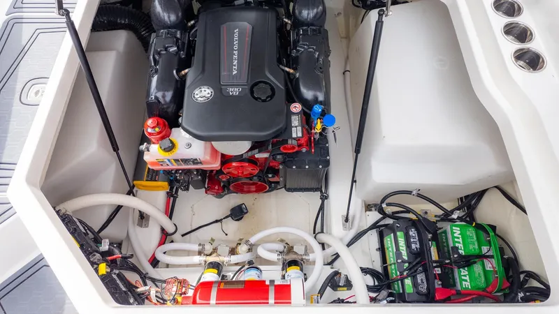Slide: The Image of Engine compartment of a Cobalt R6 Surf boat with a clean layout and battery. - 15