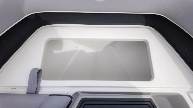 Slide: The Image of A storage compartment inside a boat with cushioned seating. - 24
