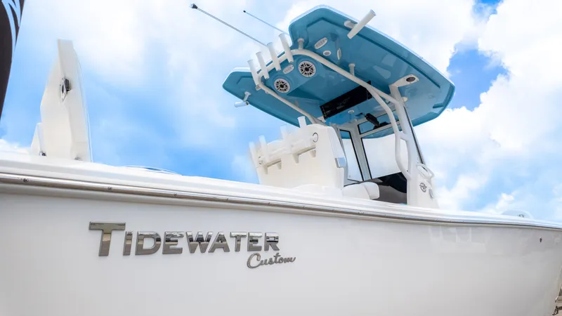 The Image of Tidewater 2700 Carolina Bay 2026 with blue T-top and speakers. - 1