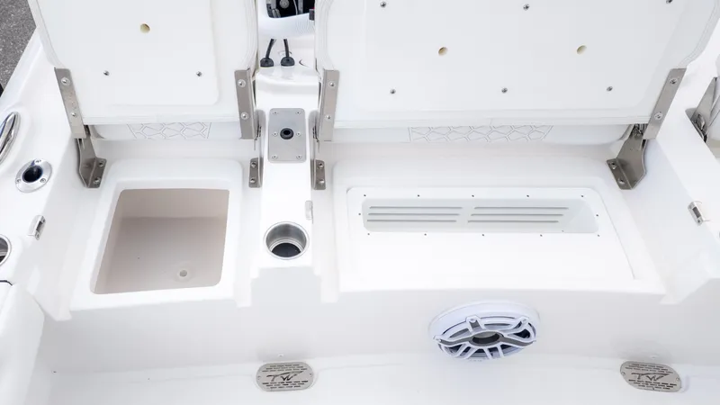 Slide: The Image of The image shows the deck of a Tidewater 2700 Carolina Bay boat with storage and a speaker. - 6