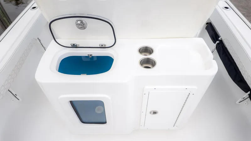Slide: The Image of The image shows a white boat console with a blue basin and two cup holders. - 9