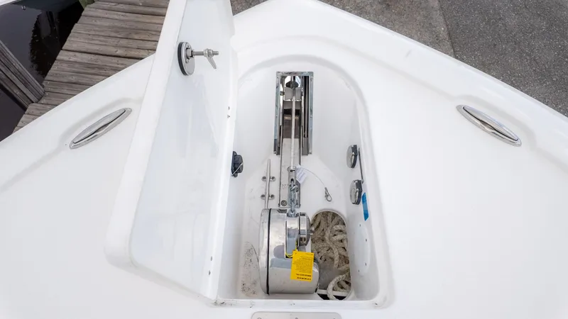 Slide: The Image of The image shows the anchor locker of a Tidewater 2700 Carolina Bay boat. - 21
