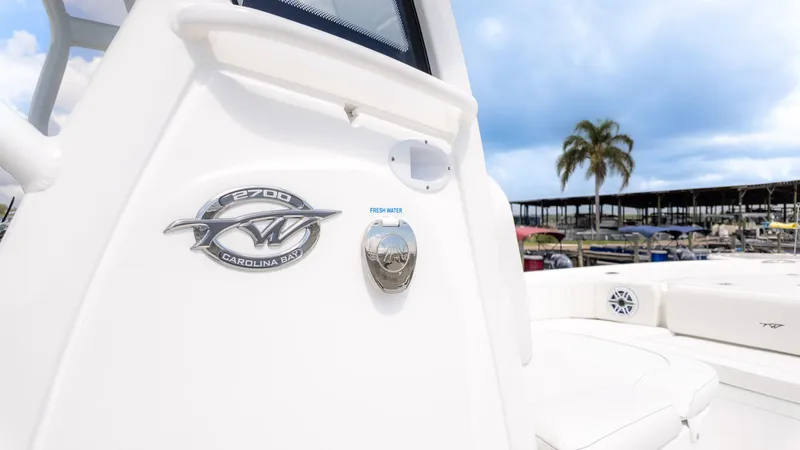 Slide: The Image of Close-up of the 2026 Tidewater 2700 Carolina Bay with logo and freshwater connection. - 13