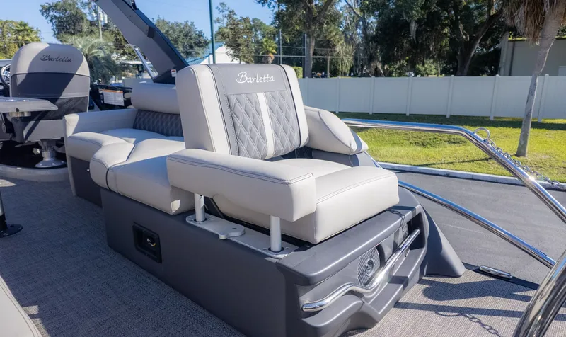 Slide: The Image of A sleek seat on a modern boat with gray and white upholstery. - 8