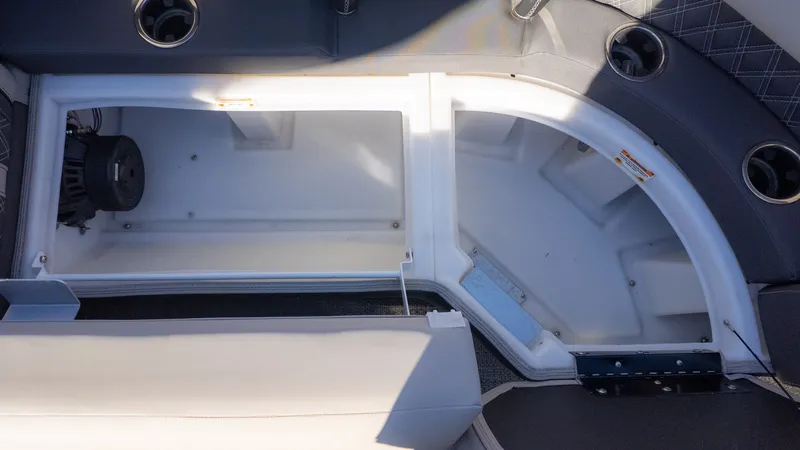 Slide: The Image of Interior view of a 2024 Barletta Reserve Leggera 26MA with storage compartment and speaker. - 19