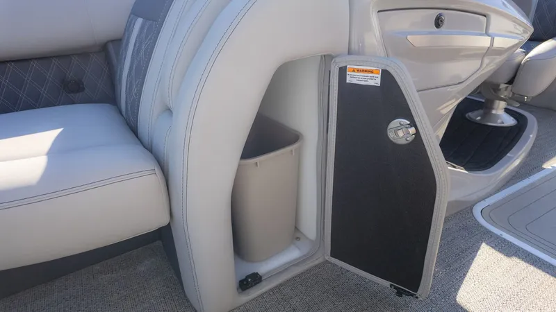 Slide: The Image of The image shows the interior of a 2024 Barletta Reserve Leggera 26MA with an open storage compartment. - 21