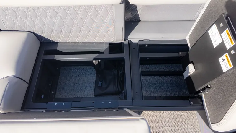Slide: The Image of Interior view of a 2024 Barletta Reserve Leggera 26MA with seating and storage space. - 14