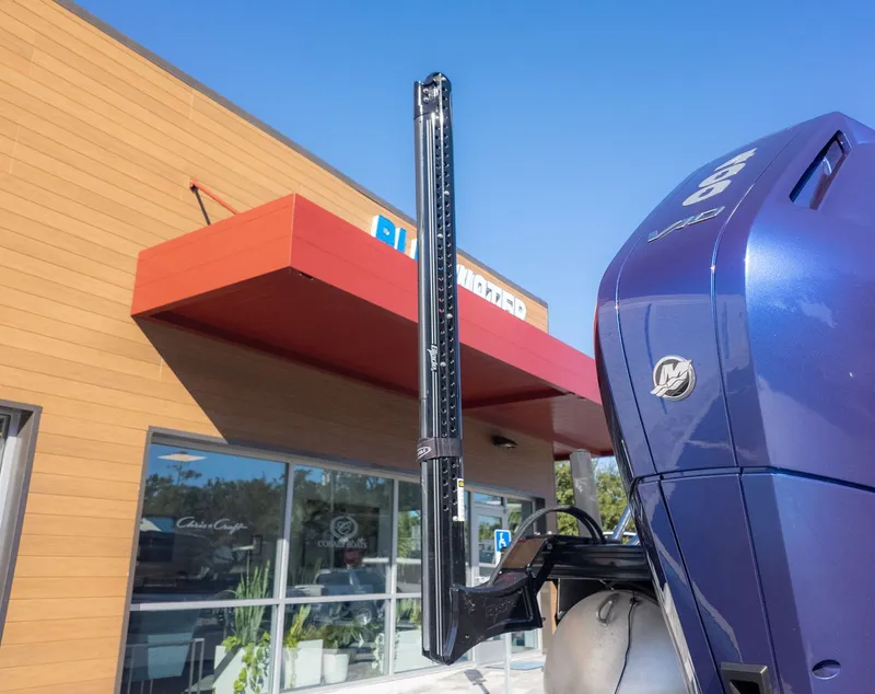 Slide: The Image of Close-up of an outboard motor near a building. - 6