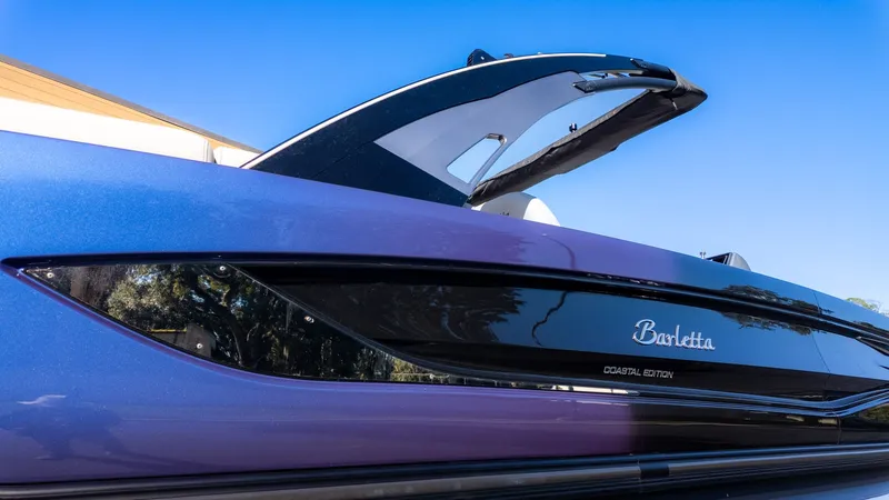 Slide: The Image of Close-up of a 2024 Barletta Reserve Leggera 26MA with sleek design and glossy finish. - 25