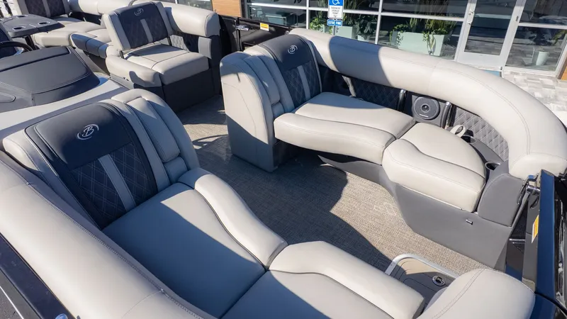 Slide: The Image of The image shows the luxurious interior of a 2024 Barletta Reserve Leggera 26MA with elegant seating. - 18