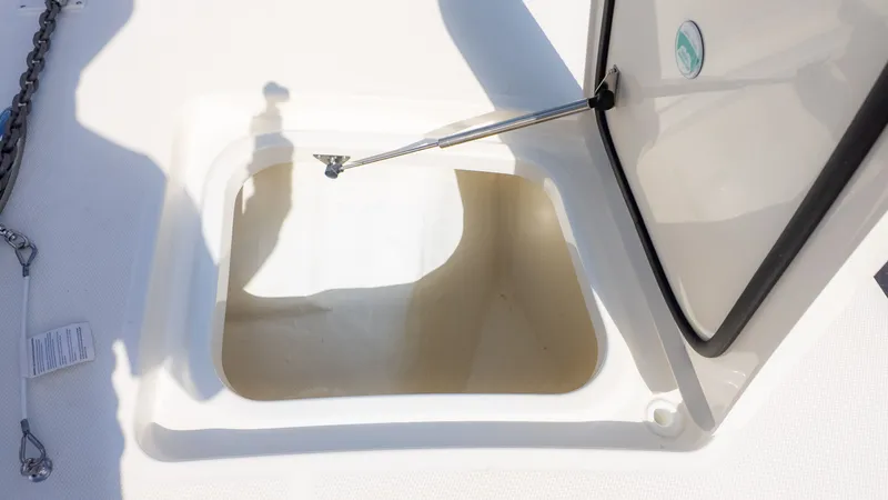 Slide: The Image of Open storage compartment on a boat with hydraulic support. - 26